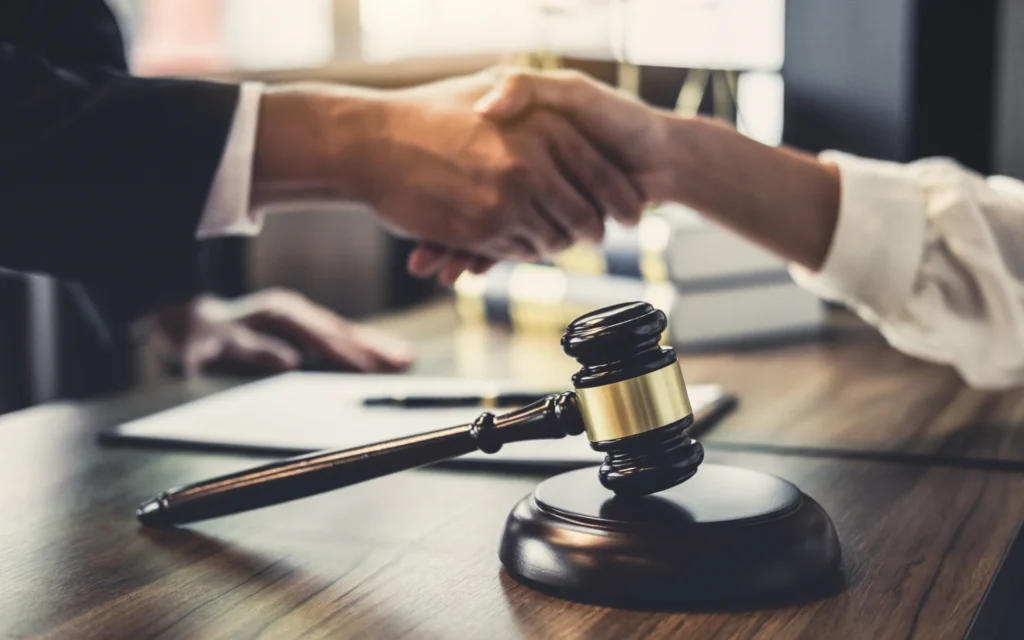 Handshake over a judge's gavel