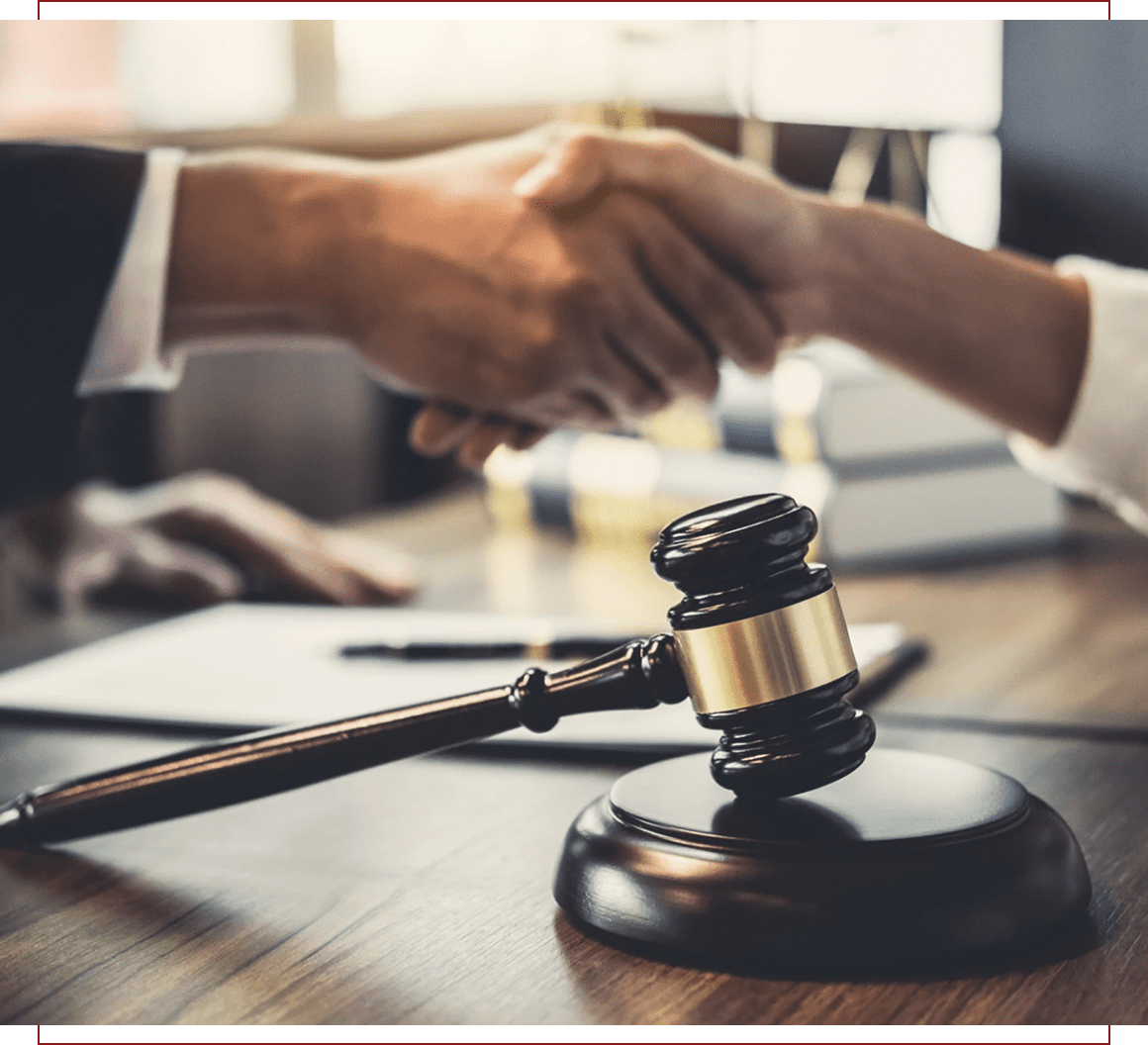 Lawyers shaking hands in office setting